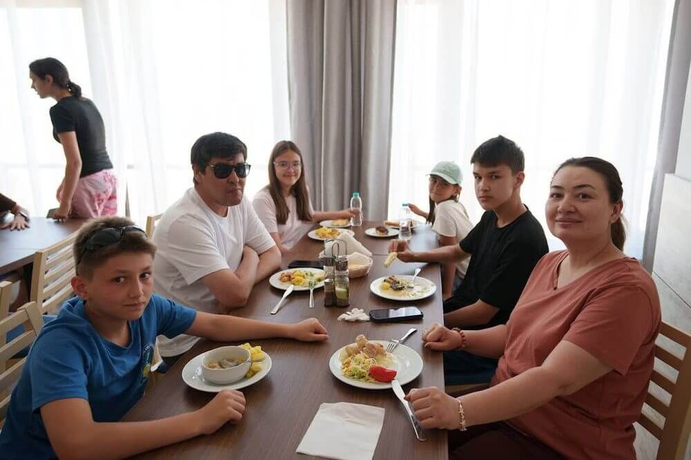 A family having dinner together on campus