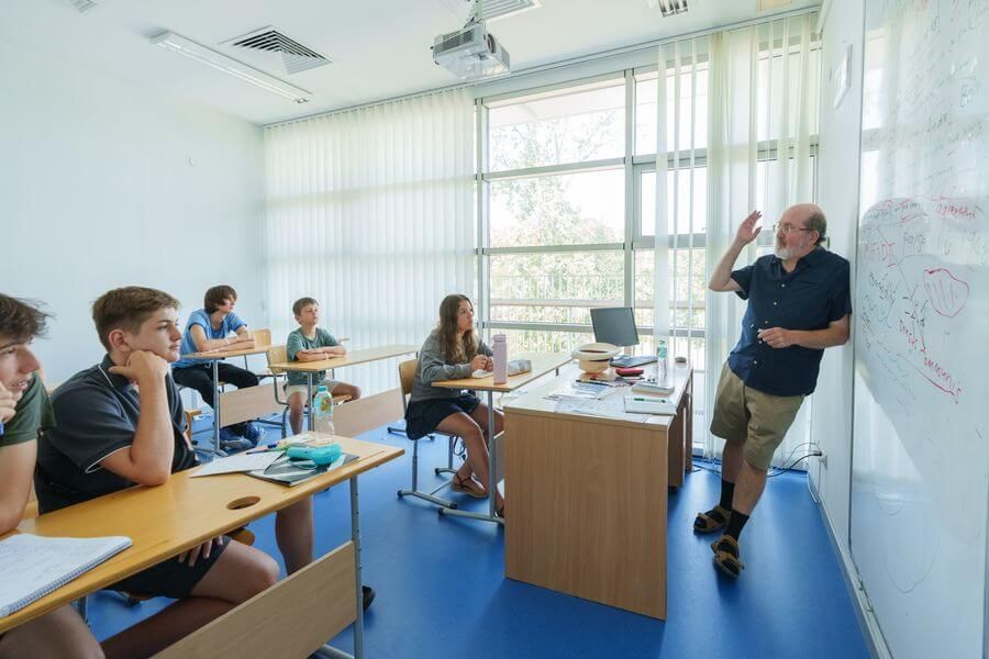 Teacher at the whiteboard with students