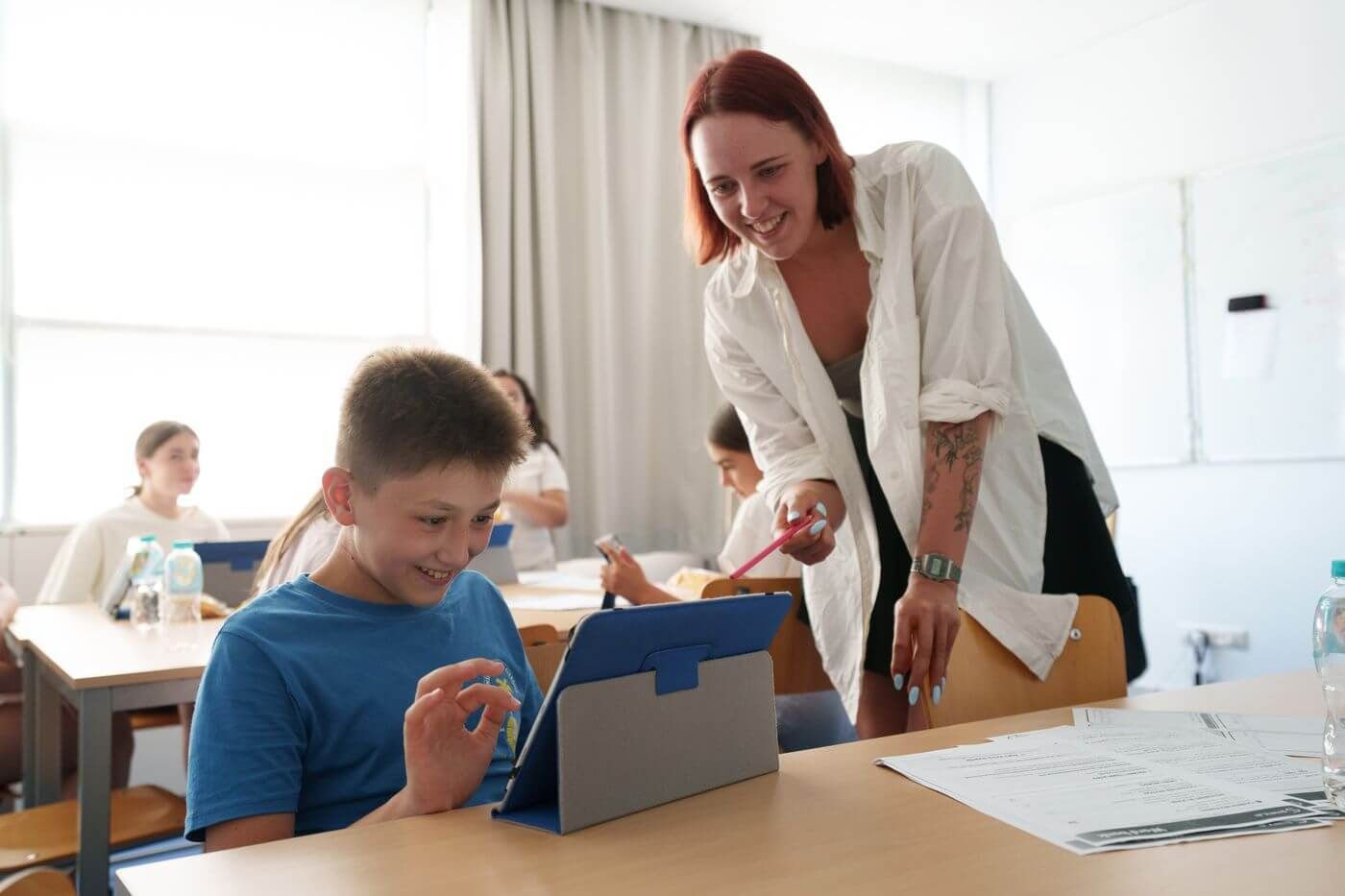 A VIEC teacher working with students