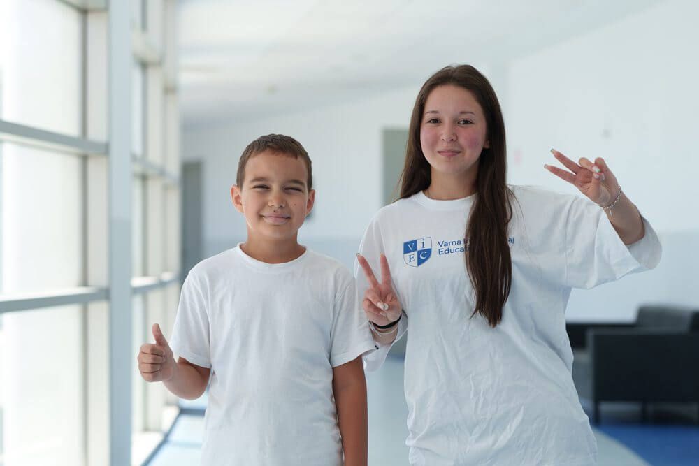 Campers in VIEC T-shirts giving a thumbs-up