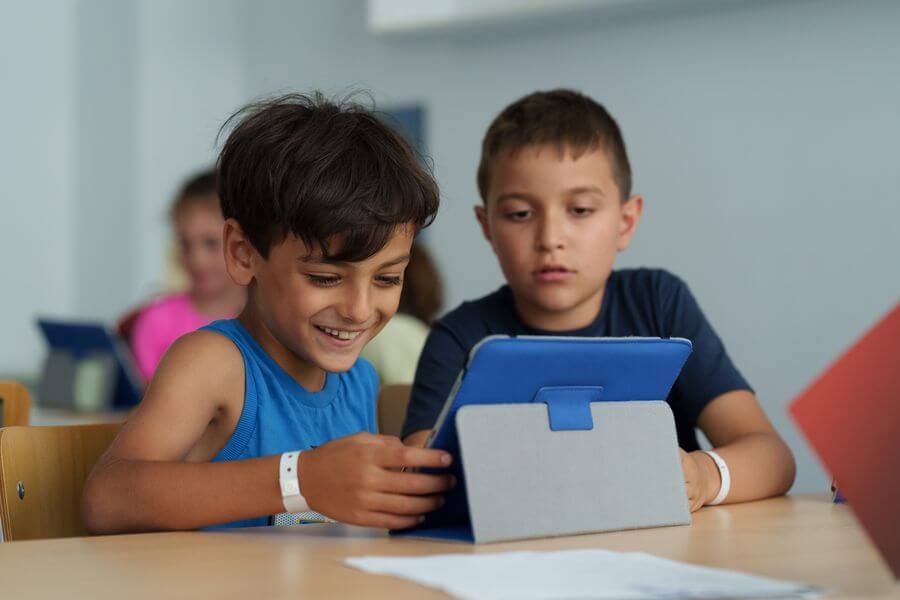 Two boys working on a tablet project