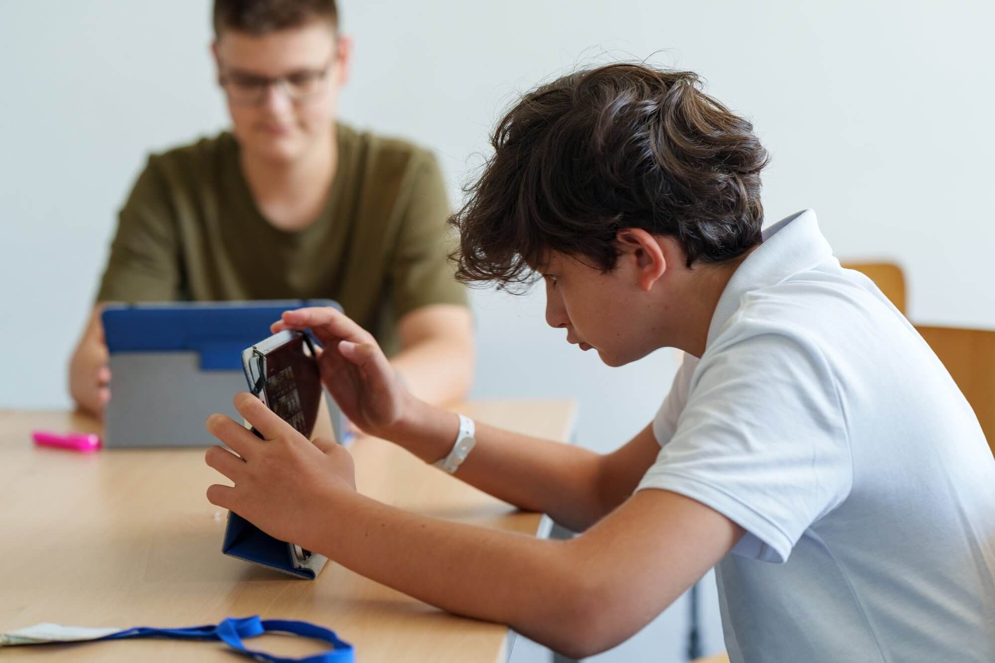 Two students working on a tablet during a morning lesson at VIEC